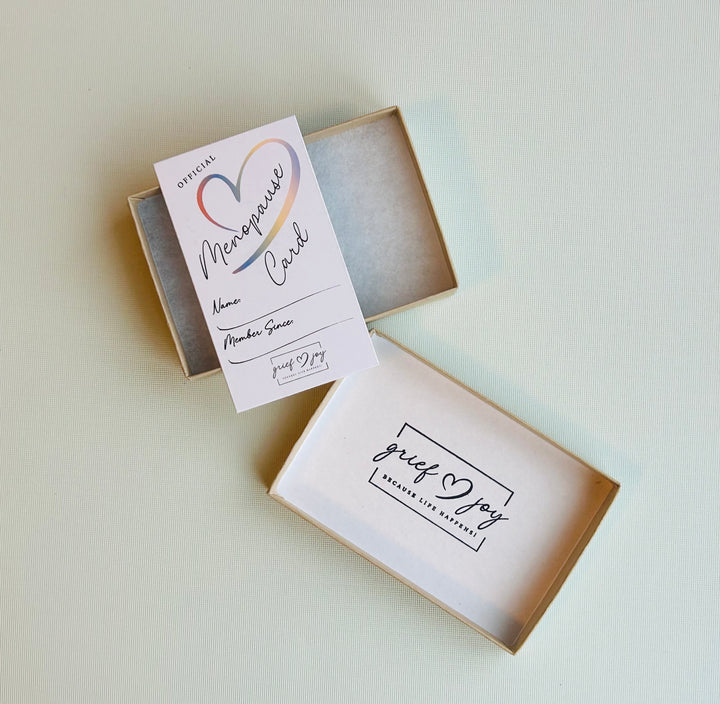Offcial menopause card laying on top of gift box